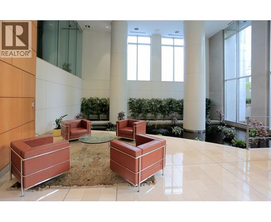 A lobby area with a glass wall and a sign that says REALTOR.