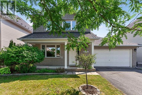 A house with a tree in front of it.