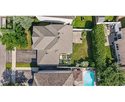 A house with a swimming pool in the backyard.