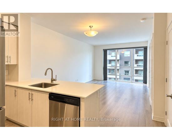 A kitchen with a dishwasher and a sink.