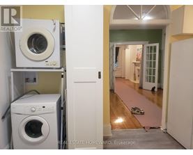 A laundry room with a washer and dryer in it.