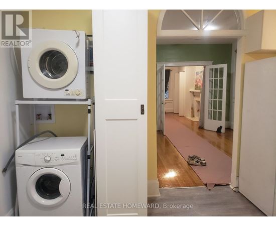 A laundry room with a washer and dryer in it.