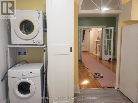 A laundry room with a washer and dryer in it.
