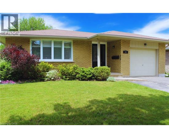 A house with a red roof and a white garage door.