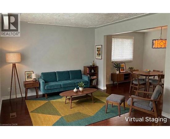 A living room with a blue couch and a wooden coffee table.