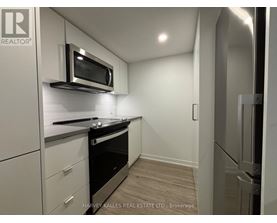 A modern kitchen with a microwave above the stove.