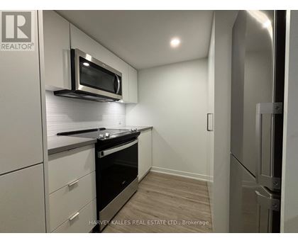 A modern kitchen with a microwave above the stove.