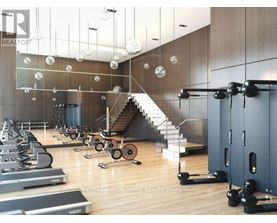 A gym with a variety of equipment including treadmills, weights, and a staircase.