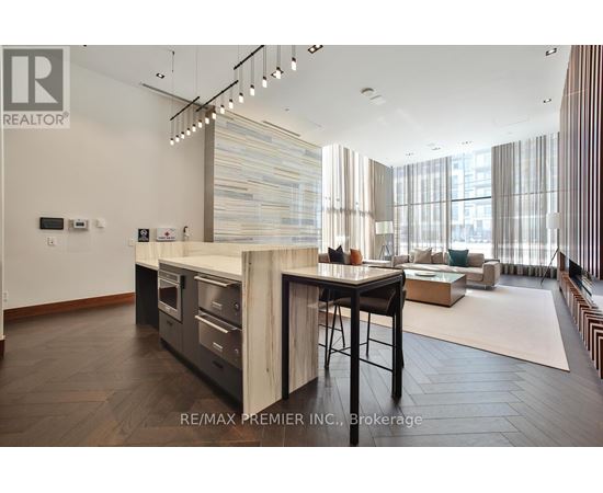 A modern kitchen with a dining table and chairs.