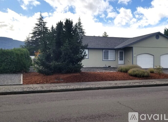A house with a mountain in the background.