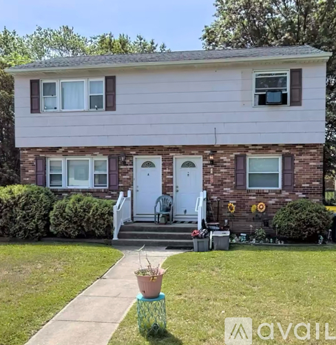 A house with a white door and a small porch.