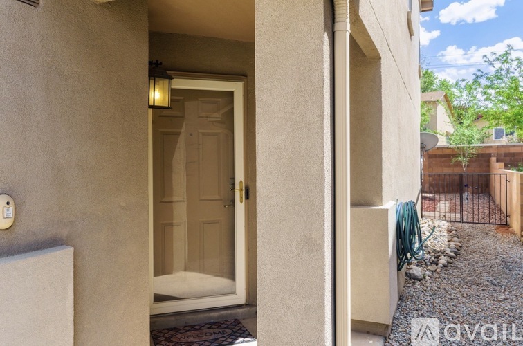 A doorway with a mat on the floor leading to a room.