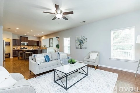 A living room with a white couch and a coffee table.