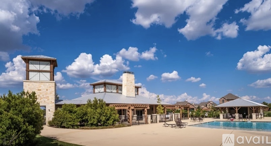 A large house with a pool in the backyard.
