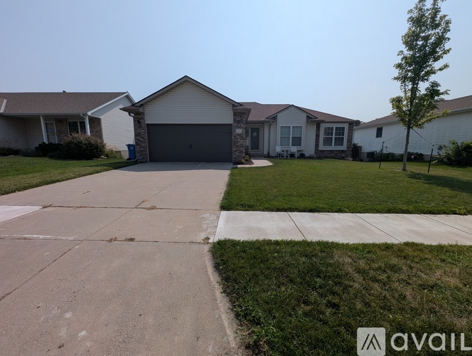 A house with a driveway in front of it.
