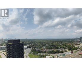 A view of a cityscape from a high vantage point with a large building in the foreground.