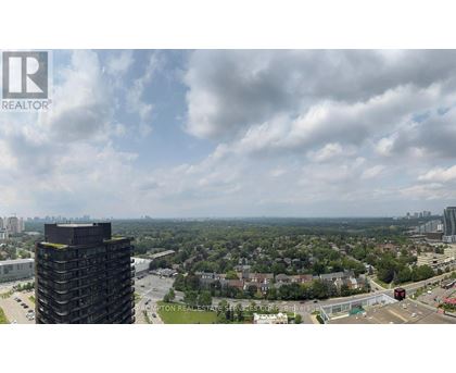 A view of a cityscape from a high vantage point with a large building in the foreground.