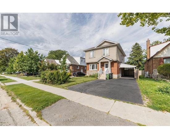 A large house with a driveway in front of it.