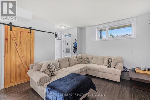 A living room with a couch and a sliding door.