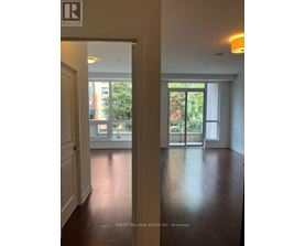 A realtor sign is on the door.