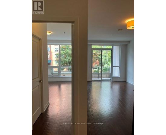 A realtor sign is on the door.