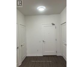 A white door is in the middle of two white walls.