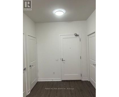 A white door is in the middle of two white walls.