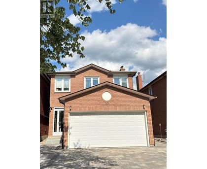 A house with a white garage door in front.