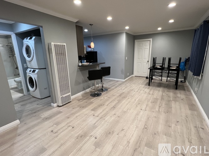 A room with a washer and dryer in it.