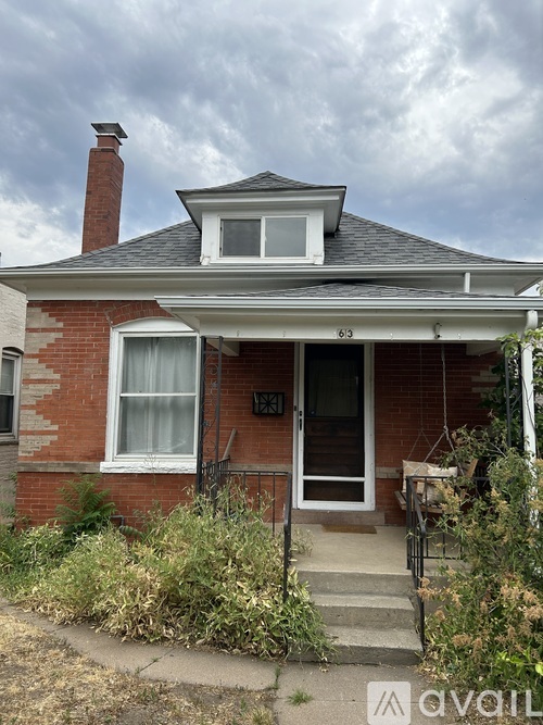 A house numbered 631 is shown with a front porch and a small front yard.