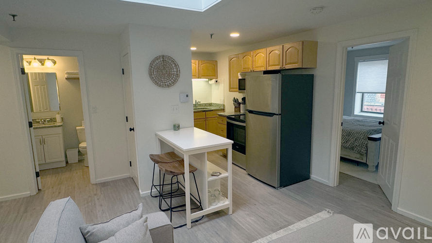 A kitchen with a table and chairs in the middle of the room.