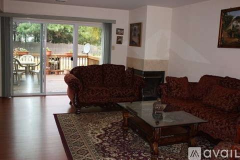 A living room with a couch and a coffee table.