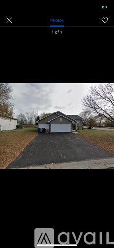 A house with a driveway in front of it.