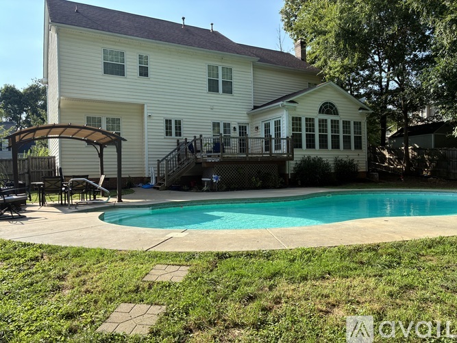 A house with a pool in the backyard.