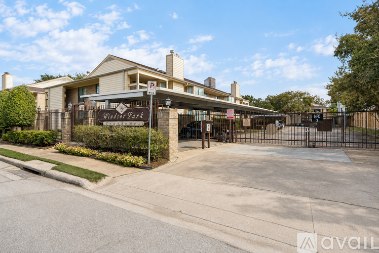 The image shows a gated entrance to a residential area named "Wild Park".