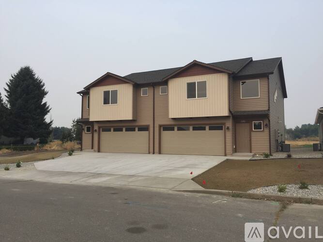 A house with a garage is available for sale.