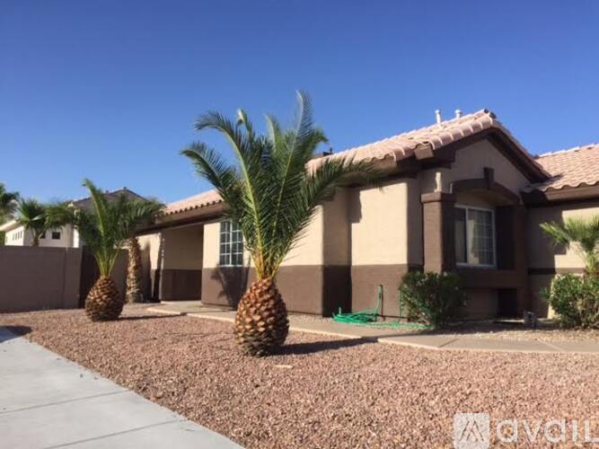 A house with a brown roof and tan walls has a pineapple in front of it.