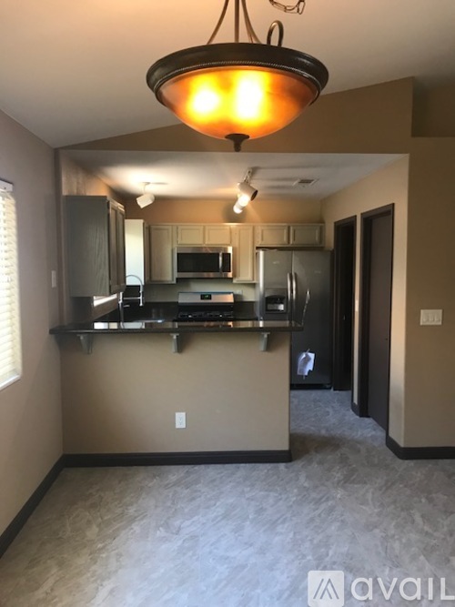 A kitchen with a counter and cabinets.