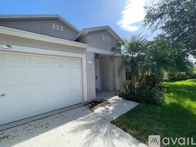 A house with a white garage door is for sale.