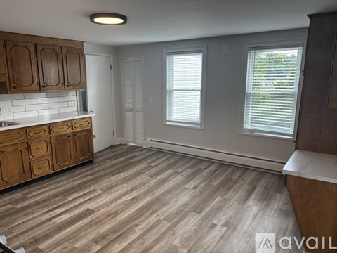 A kitchen with wooden cabinets and a countertop.