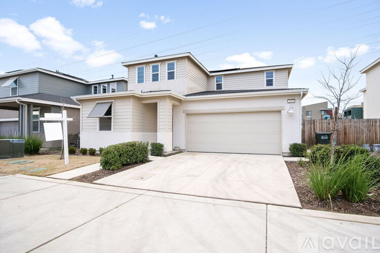 A house with a garage is for sale.