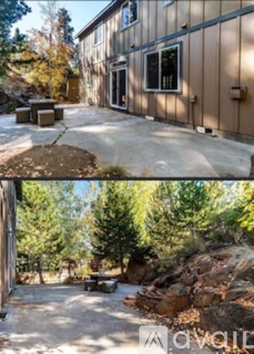 A house with a brown exterior and a concrete driveway.