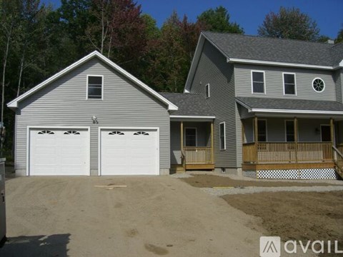 A house with a garage is available for sale.