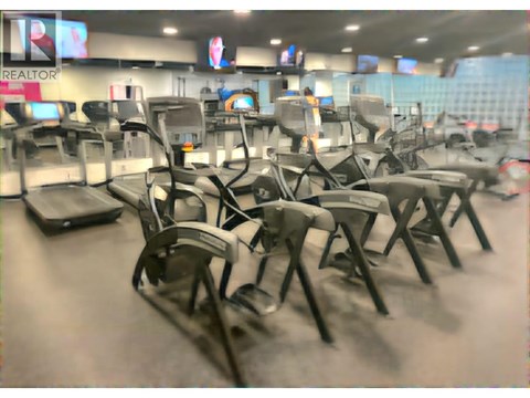 A room with chairs and a sign that says REALTOR.