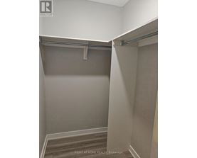 A room with a grey wall and a grey floor.