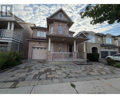 A large house with a driveway in front of it.