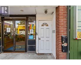 A realtor office with a white door and a glass window.
