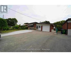 A house with a garage is for sale.