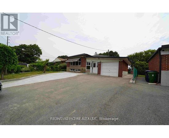 A house with a garage is for sale.