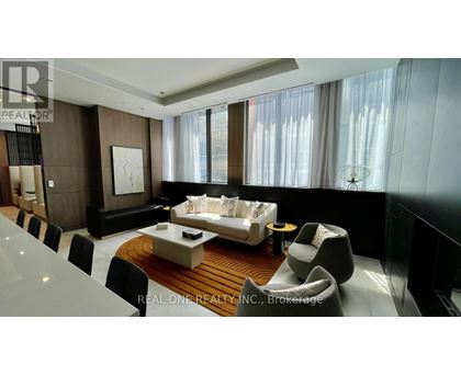 A modern living room with a large sofa and a coffee table.